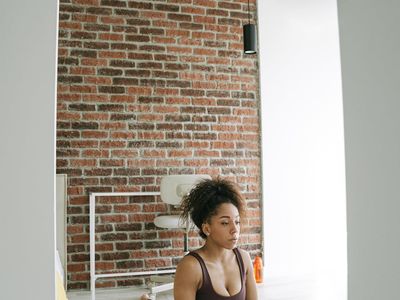 A quiet room with an exercise mat ready for practice.